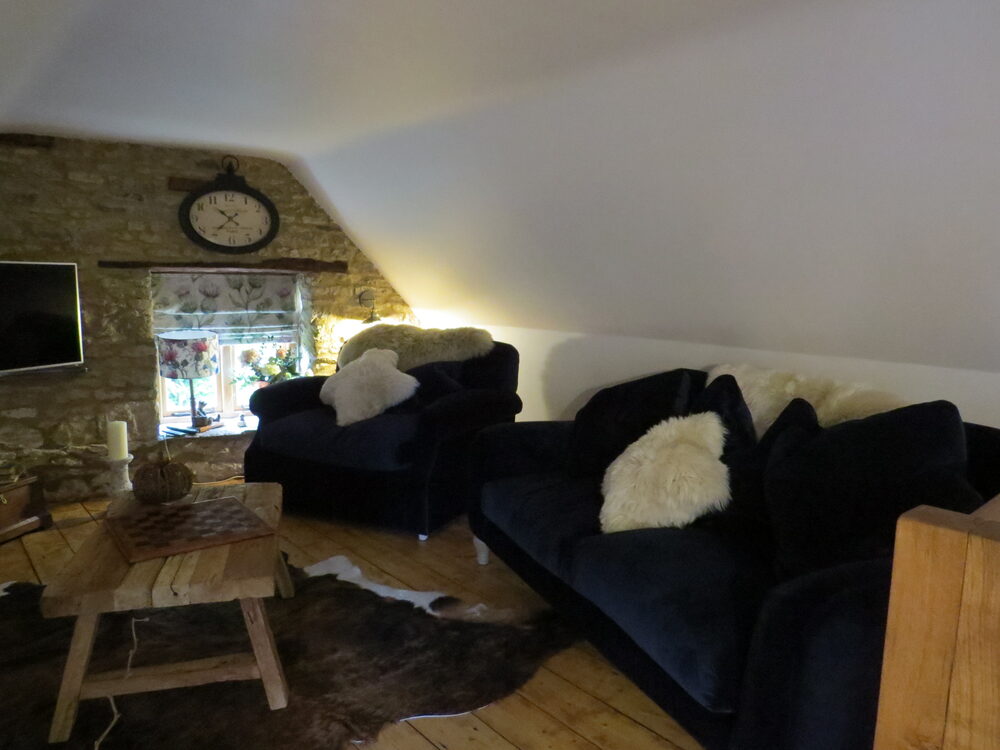Loft sitting room with velvet sofas